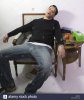 man-sat-down-at-home-and-asleep-and-snoring-A02MF3.jpg
